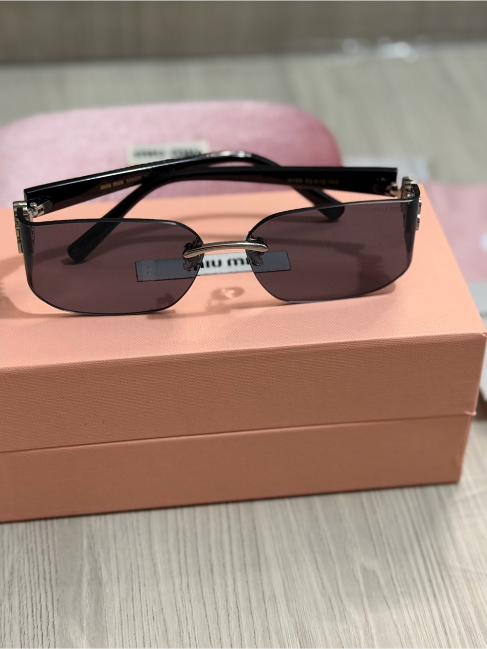 Miu Miu Slim Rectangular Sunglasses in Plum Tint